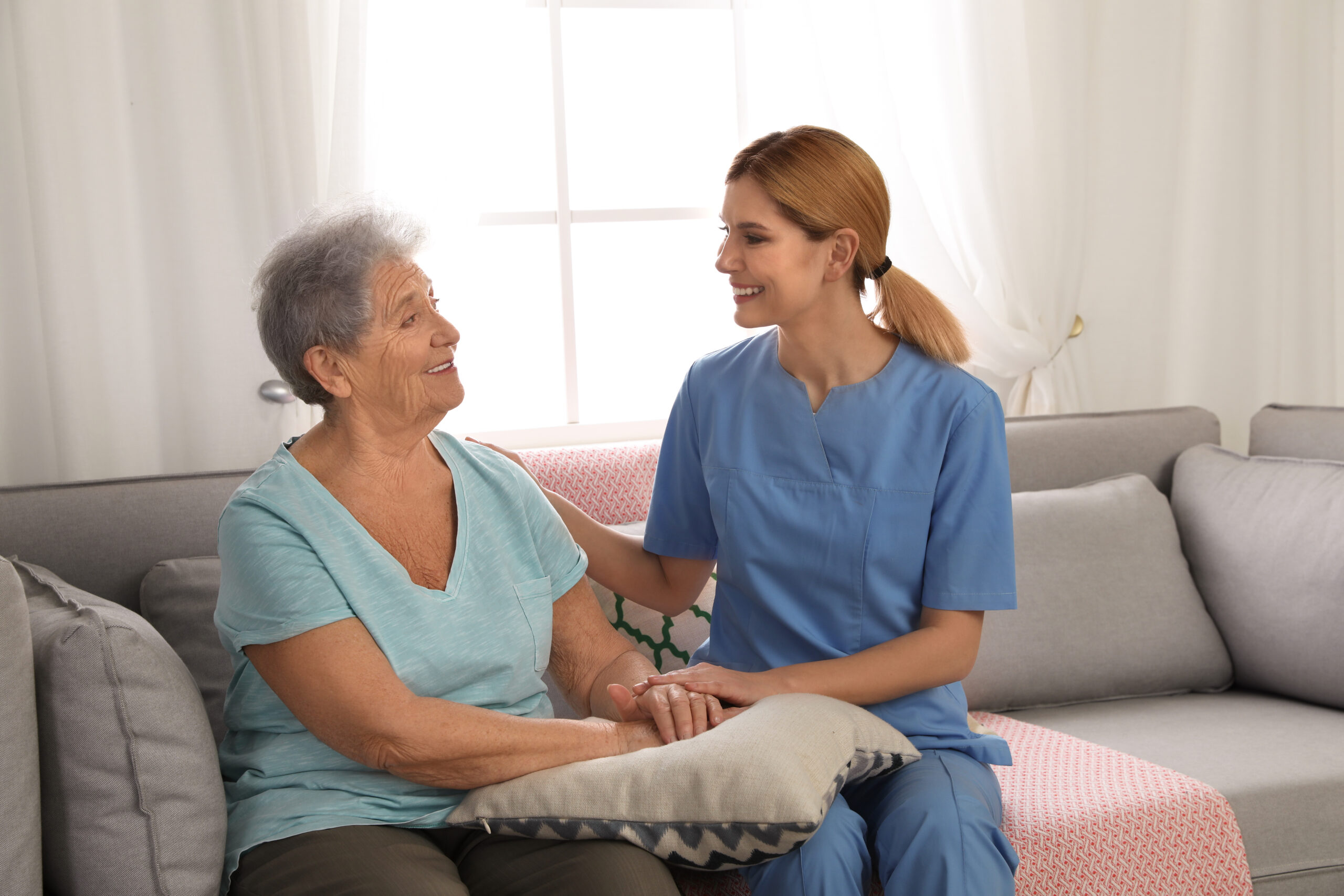 Companion care in Bethesda, MD caregiver providing friendly conversation and support through companion home care services in Bethesda, MD for seniors at home